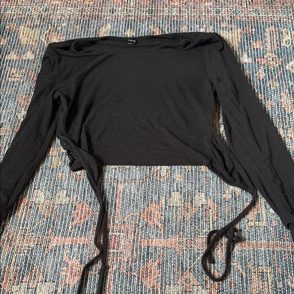 two long sleeve crops and a tank